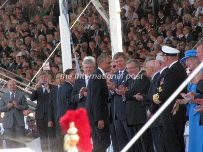 Barack Obama reaching his spot next to Giorgio Napolitano